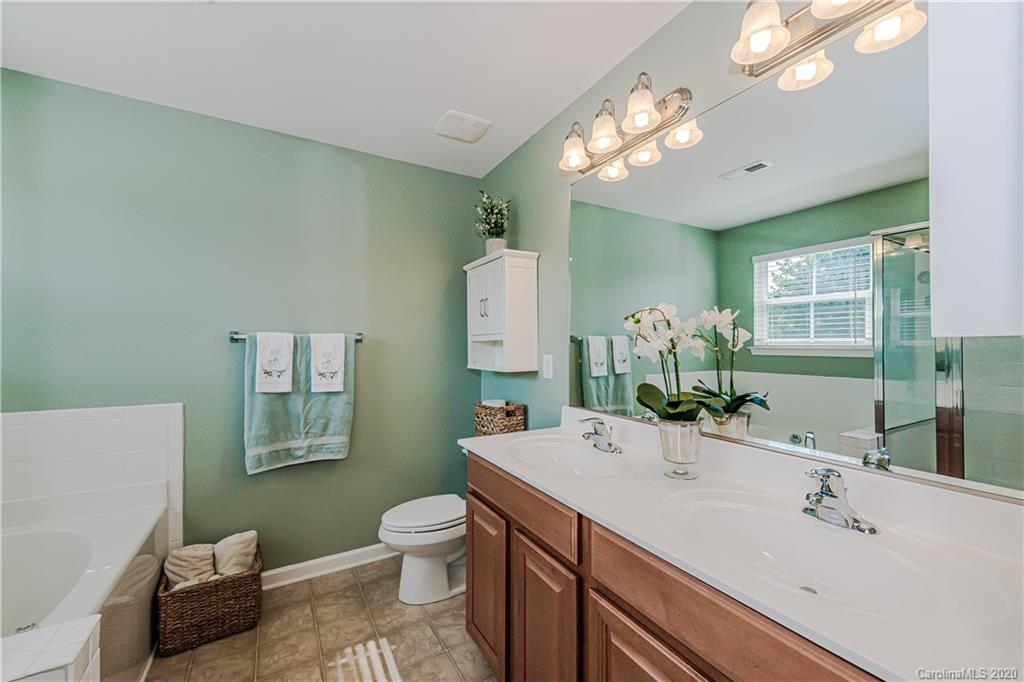640 Alsace Lane Fort Mill, SC 29708 - Photo 23 of 36 a bathroom with a sink a toilet and a mirror