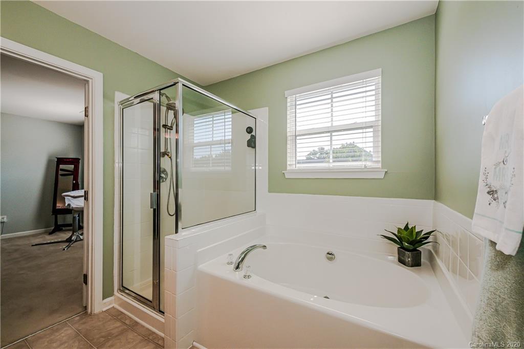 640 Alsace Lane Fort Mill, SC 29708 - Photo 24 of 36 a bathroom with a bathtub and a shower