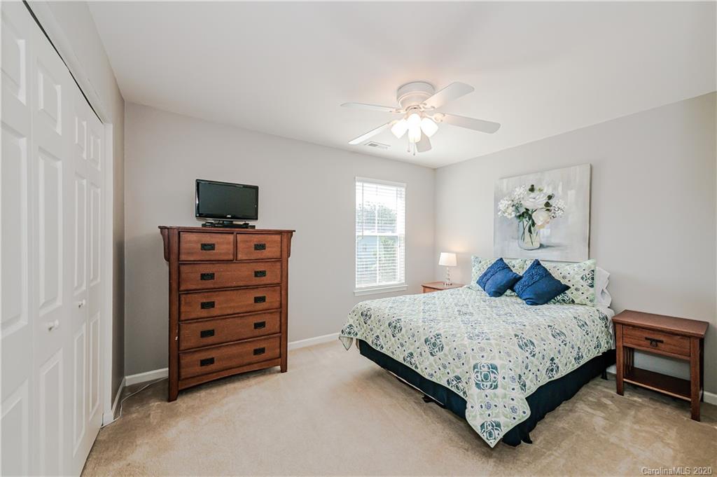 640 Alsace Lane Fort Mill, SC 29708 - Photo 28 of 36 a bedroom with a bed and dresser