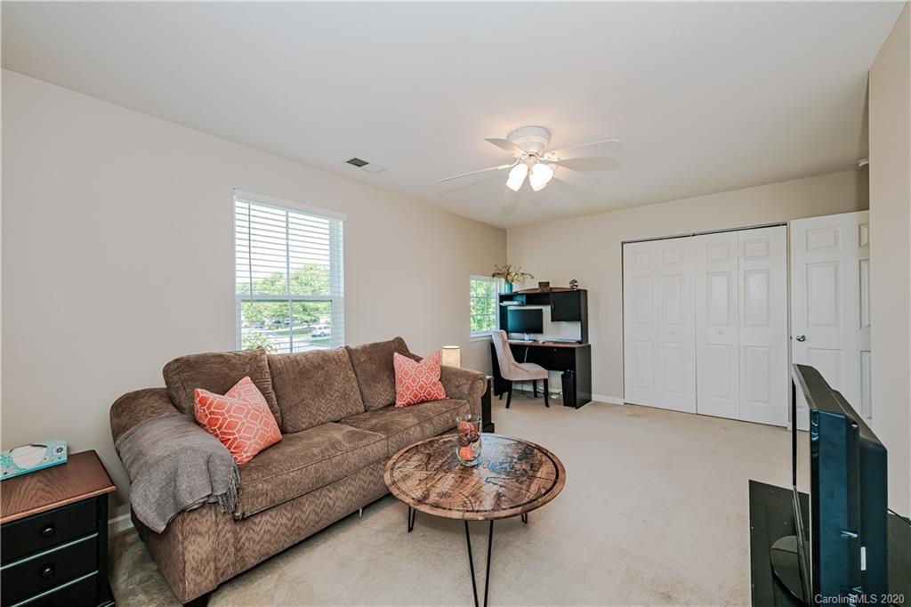 640 Alsace Lane Fort Mill, SC 29708 - Photo 30 of 36 a living room with furniture a window and a flat screen tv
