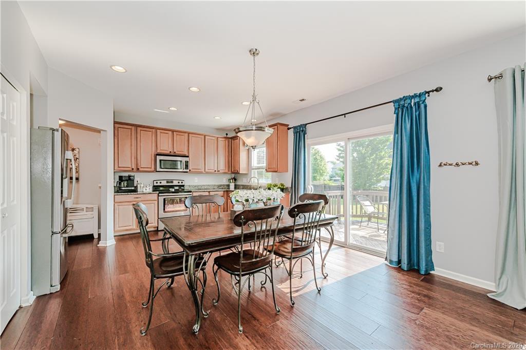 640 Alsace Lane Fort Mill, SC 29708 - Photo 10 of 36 a view of a dining room with furniture window and wooden floor