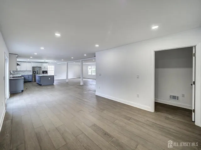 a view of a kitchen with a sink and a stove top oven