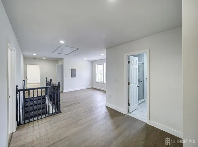 a bathroom with a sink toilet vanity and shower