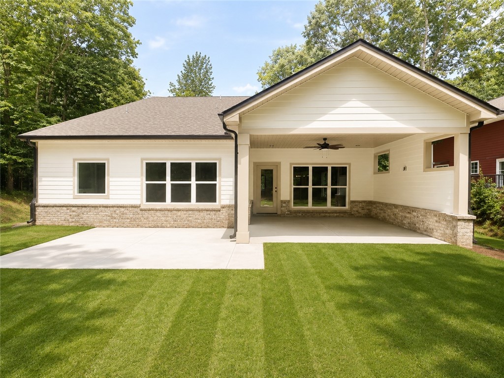 328 Point Road Westminster, SC 29693 - Photo 20 of 24 A pristine lawn stretches before a residence, offering ample outdoor living space.