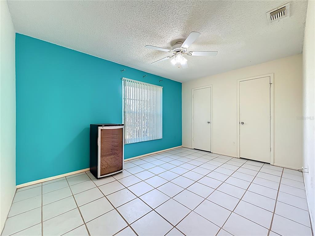 2843 Danforth Drive Orlando, FL 32818 - Photo 12 of 41 an empty room with windows