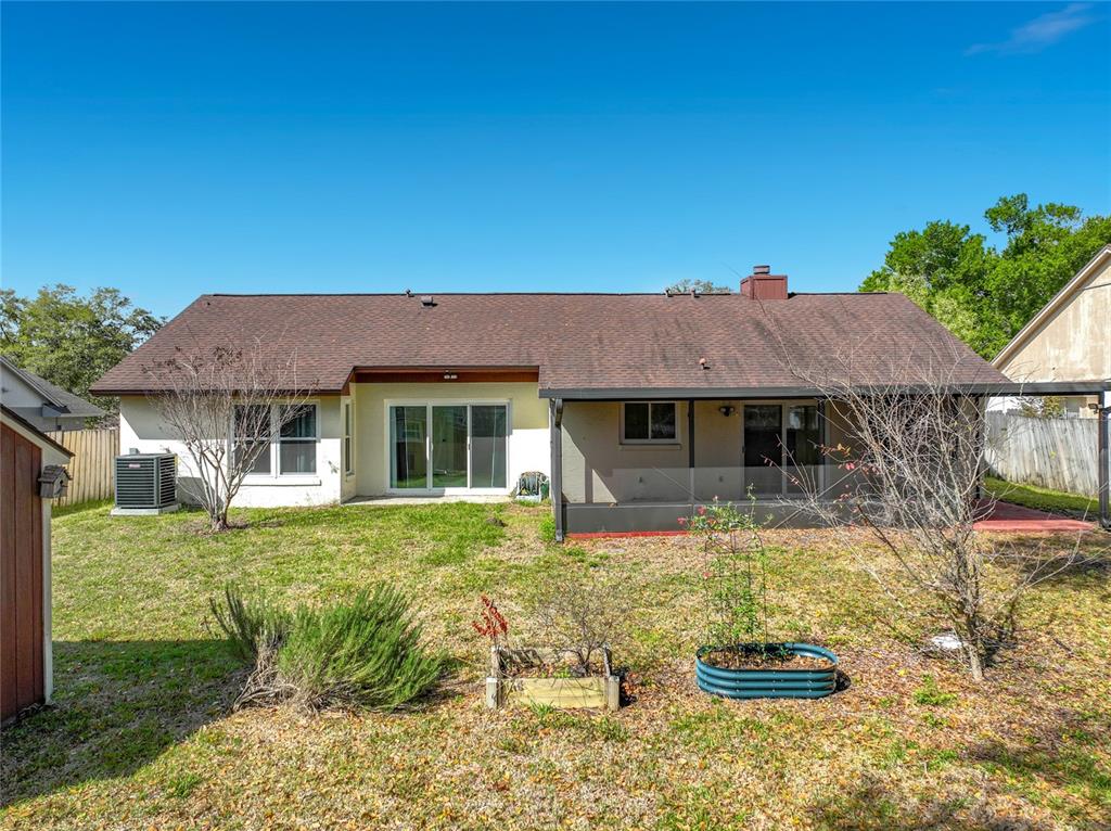 2843 Danforth Drive Orlando, FL 32818 - Photo 29 of 41 a front view of a house with a yard