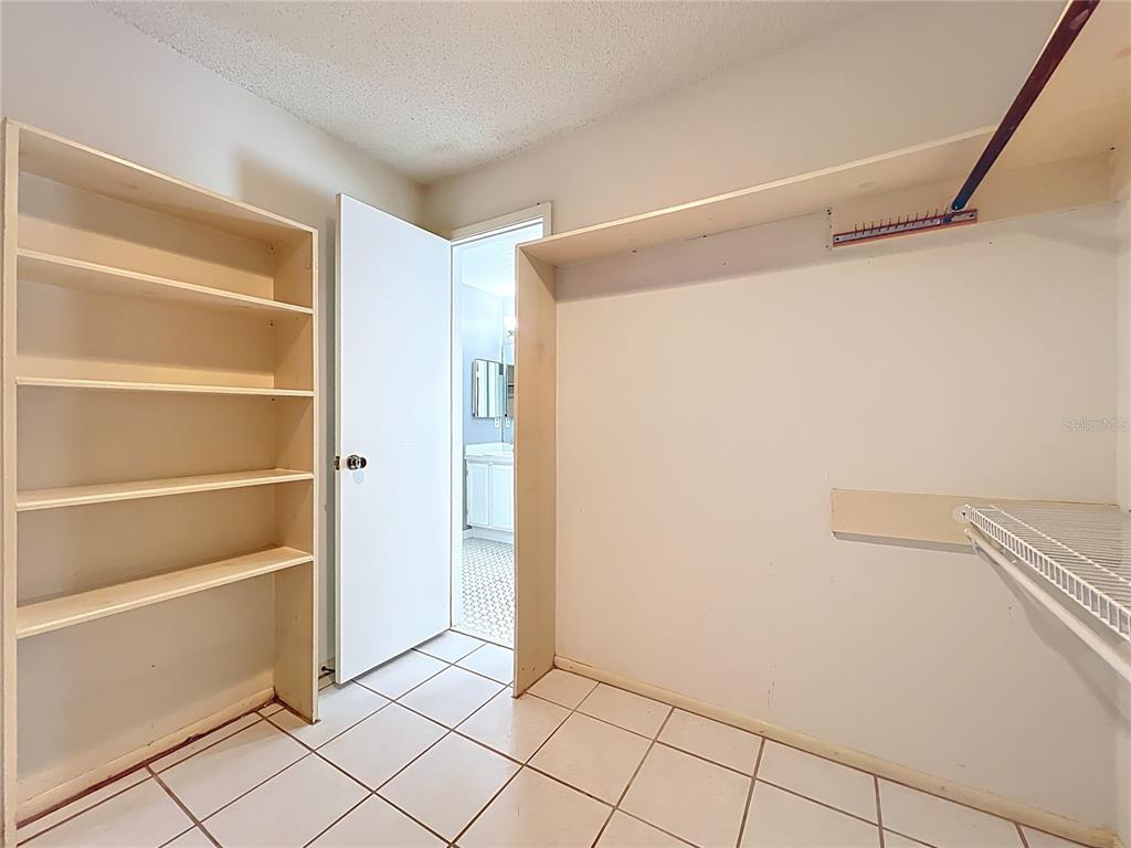 2843 Danforth Drive Orlando, FL 32818 - Photo 37 of 41 a view of an empty walk in closet