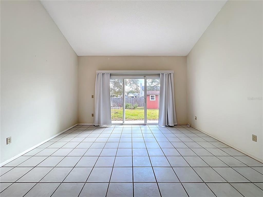 2843 Danforth Drive Orlando, FL 32818 - Photo 7 of 41 a view of an empty room and window