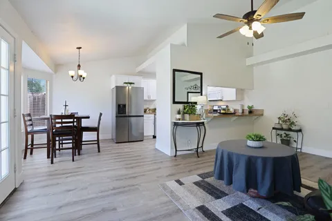 a dining room with furniture and window