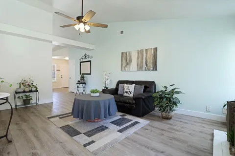 a living room with furniture and a fireplace