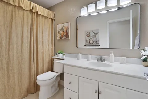 a spacious bedroom with a bed and a table