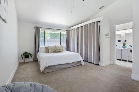 a bedroom with a bed and furniture