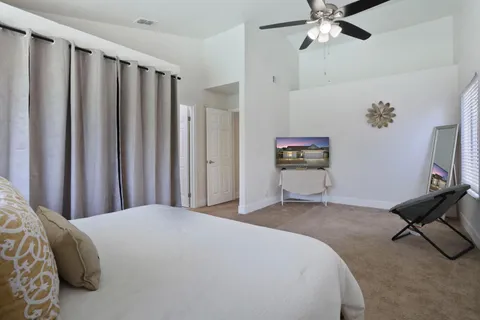 a bedroom with a bed and furniture