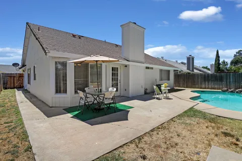 a front view of a house with a patio