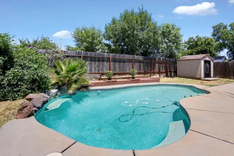 a view of a swimming pool with a porch