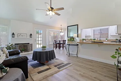 a living room with furniture and a fireplace