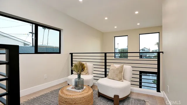 a hallway with a couch and chandelier