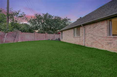 a backyard of a house with lots of green space