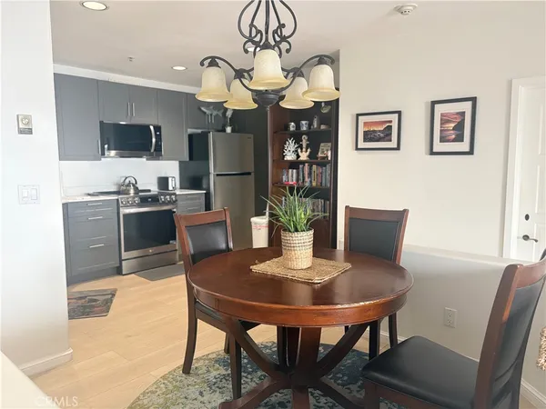 a sink with white cabinets