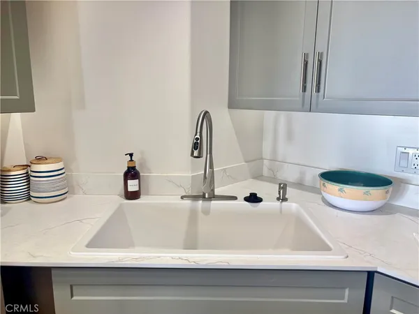 a bathroom with a sink a mirror and shower