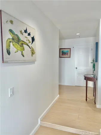 a living room with furniture and a painting