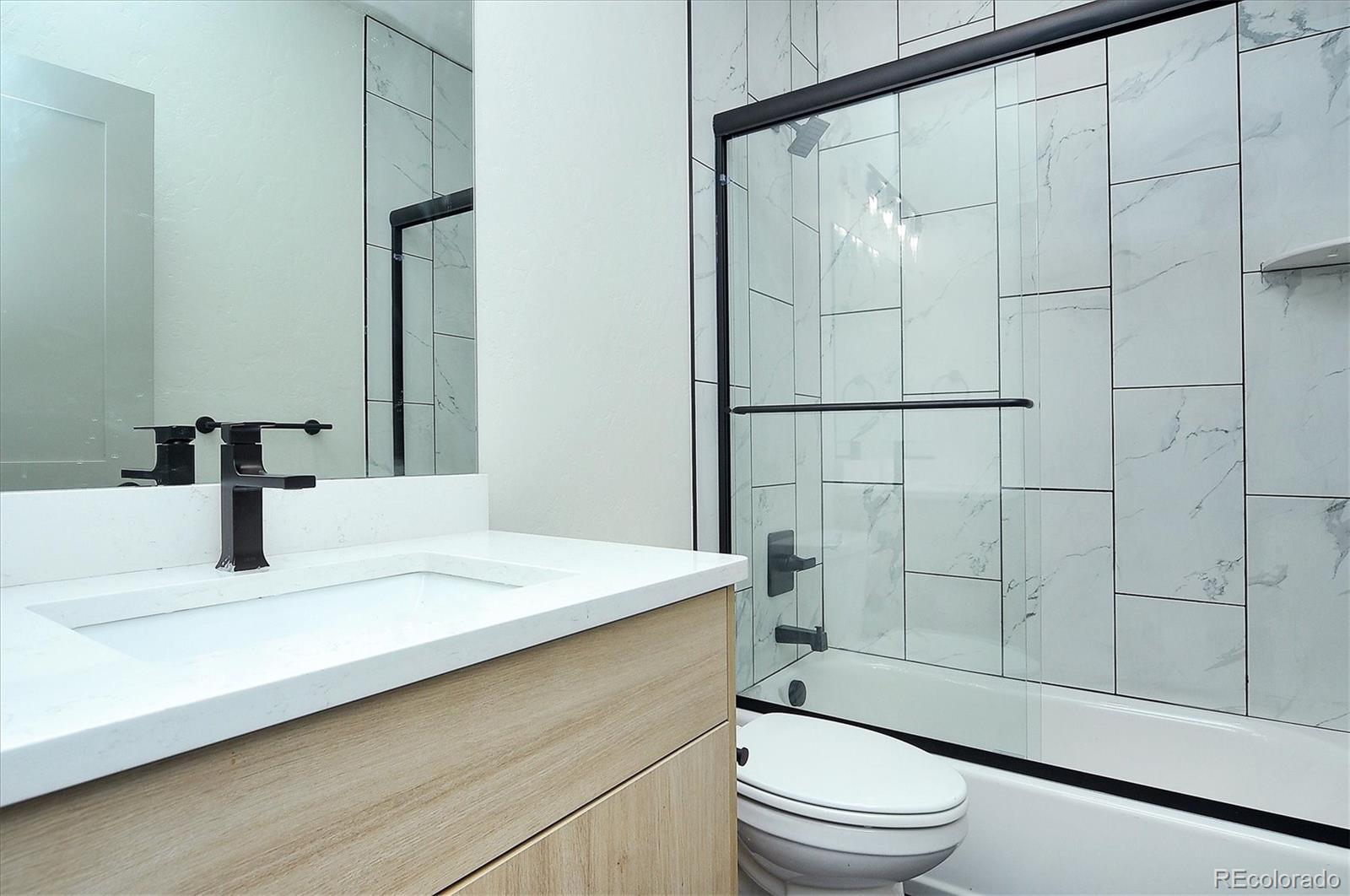 6398 Cleora Road, Unit F Salida, CO 81201 - Photo 14 of 34 a bathroom with a sink a toilet and shower