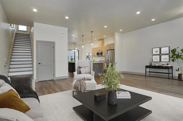 a living room with furniture and a table