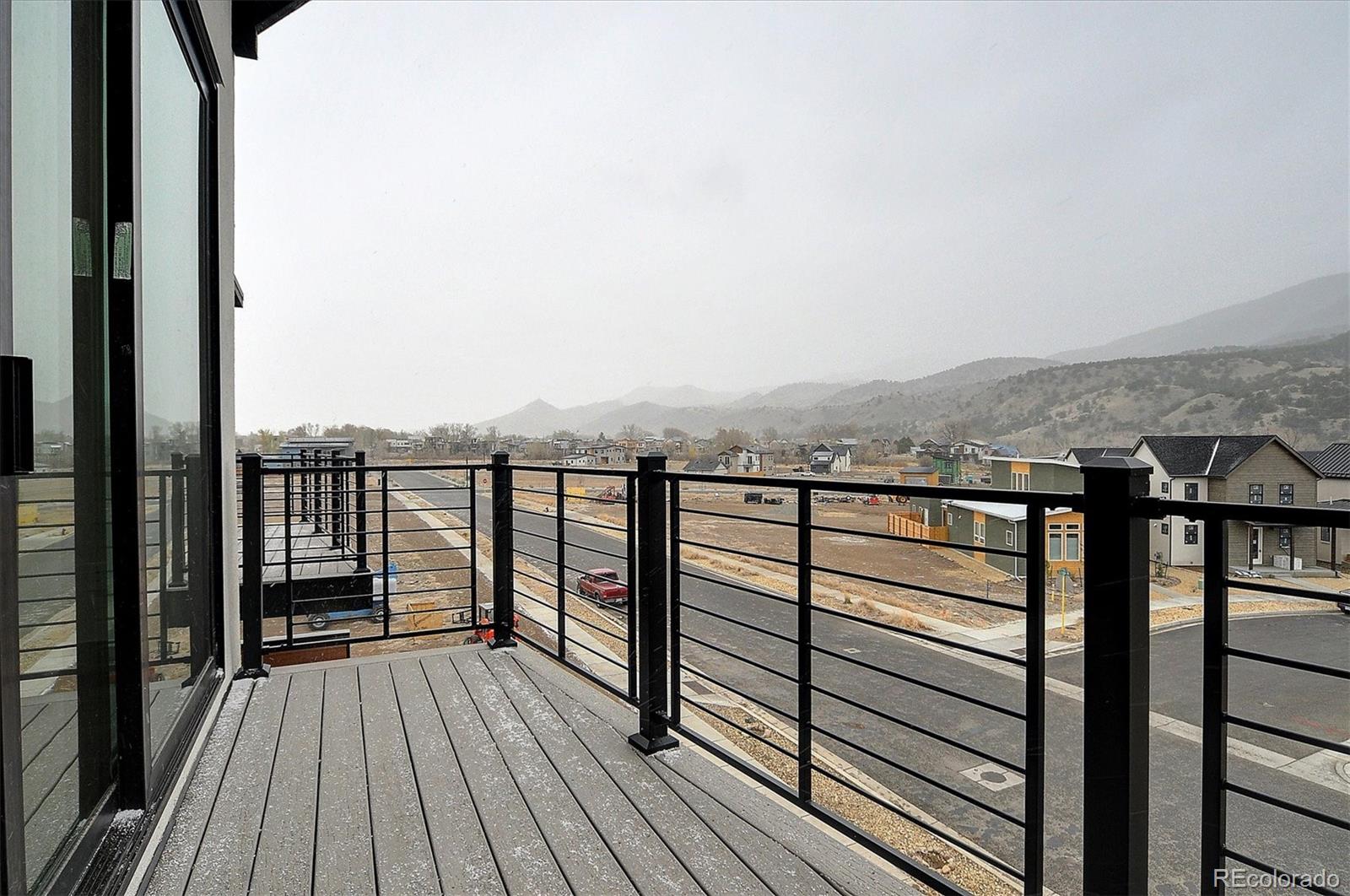 6398 Cleora Road, Unit F Salida, CO 81201 - Photo 28 of 34 a view of a balcony with wooden floor