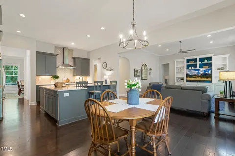 a bedroom with a beds and painting on the wall