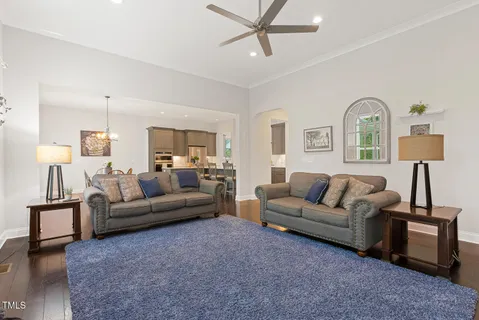 a living room with a bed furniture and a window