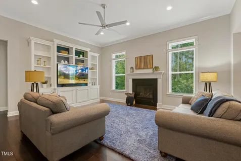 a spacious bedroom with a bed and a dresser