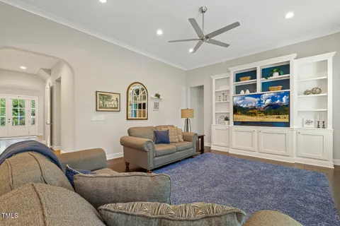a bathroom with a double vanity sink mirror and toilet