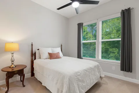 a view of room with mirror and double vanity