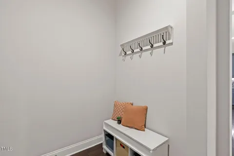 a bedroom with a bed and a night stand