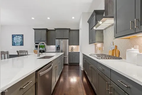 a kitchen with counter top space sink and center island