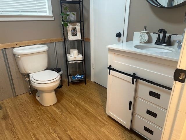 440 Angotti Road Crump, TN 38327 - Photo 14 of 30 Bathroom with vanity, hardwood / wood-style flooring, and toilet