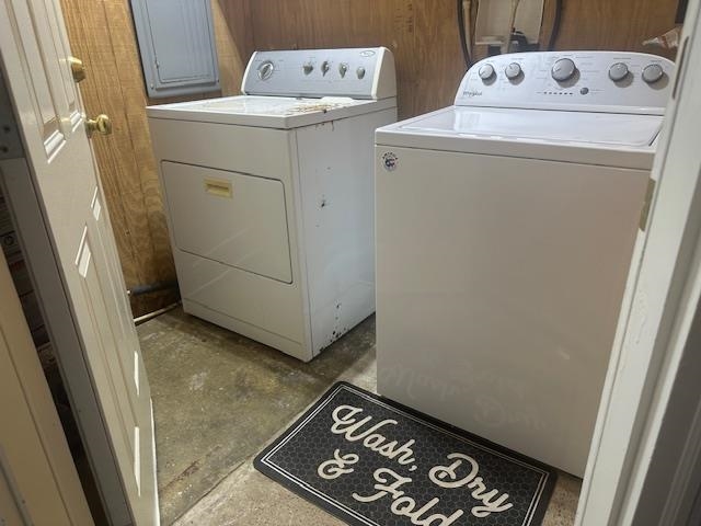 440 Angotti Road Crump, TN 38327 - Photo 20 of 30 Laundry area featuring wood walls and washing machine and clothes dryer