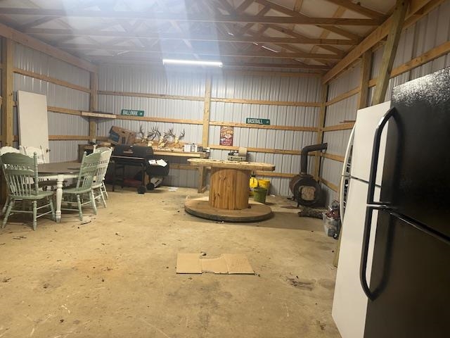 440 Angotti Road Crump, TN 38327 - Photo 21 of 30 Basement with black refrigerator