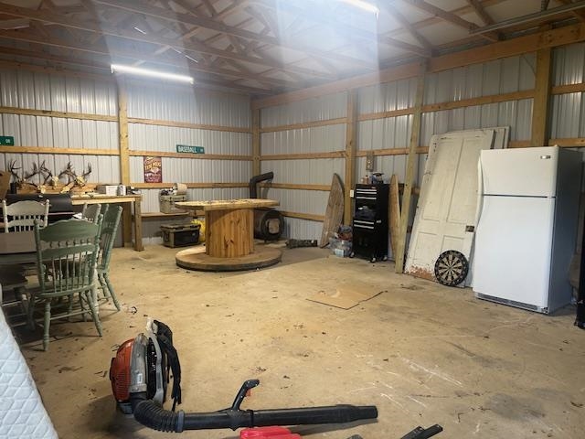 440 Angotti Road Crump, TN 38327 - Photo 22 of 30 Garage with white refrigerator