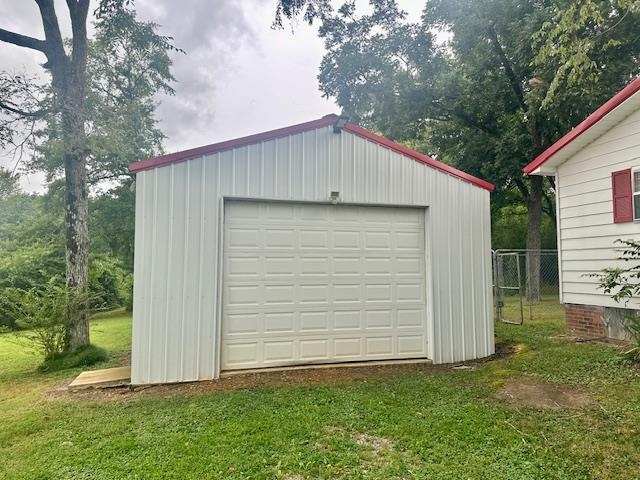 440 Angotti Road Crump, TN 38327 - Photo 26 of 30 View of outbuilding featuring a garage and a lawn