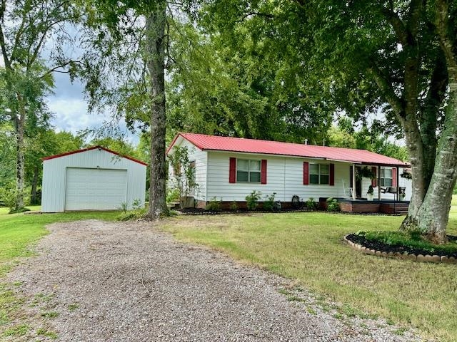 440 Angotti Road Crump, TN 38327 - Photo 28 of 30 Single story home with a garage, an outdoor structure, and a front yard