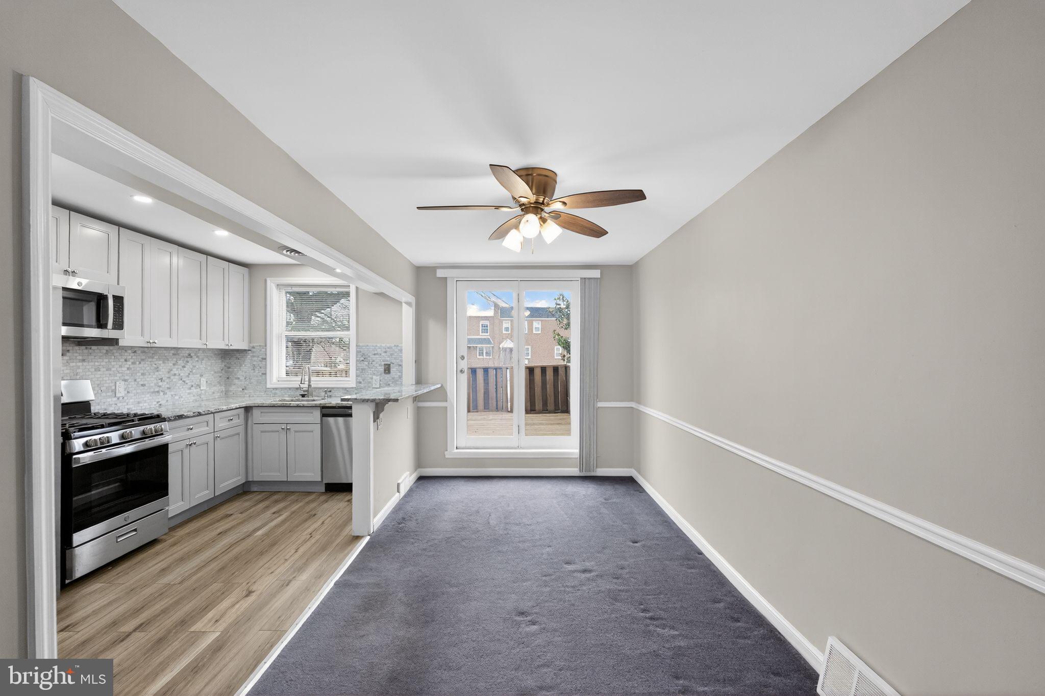 1017 Tyson Avenue Philadelphia, PA 19111 - Photo 13 of 23 a view of a kitchen with a sink and a stove top oven