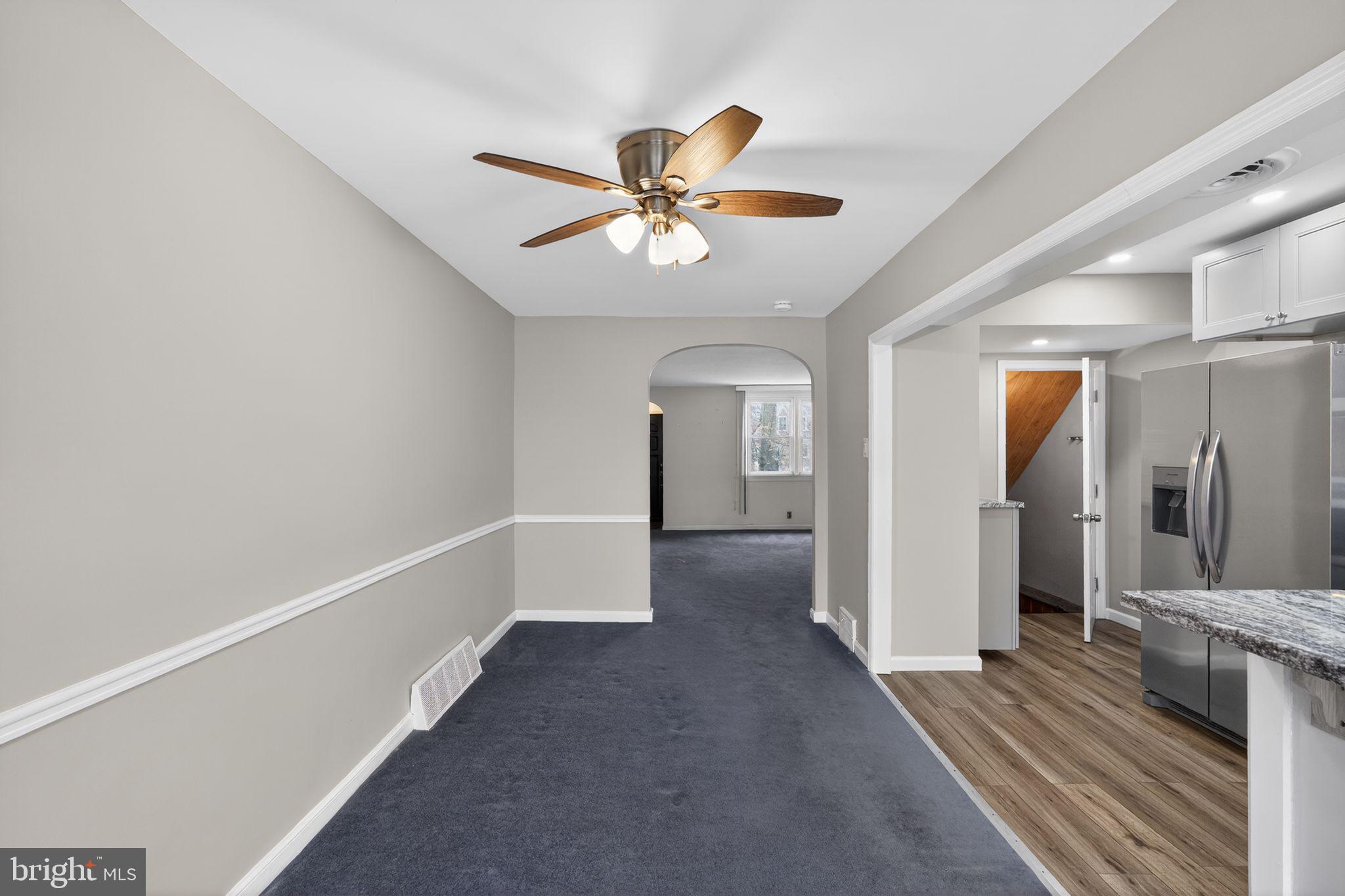 1017 Tyson Avenue Philadelphia, PA 19111 - Photo 14 of 23 a view of a hallway with a chandelier fan