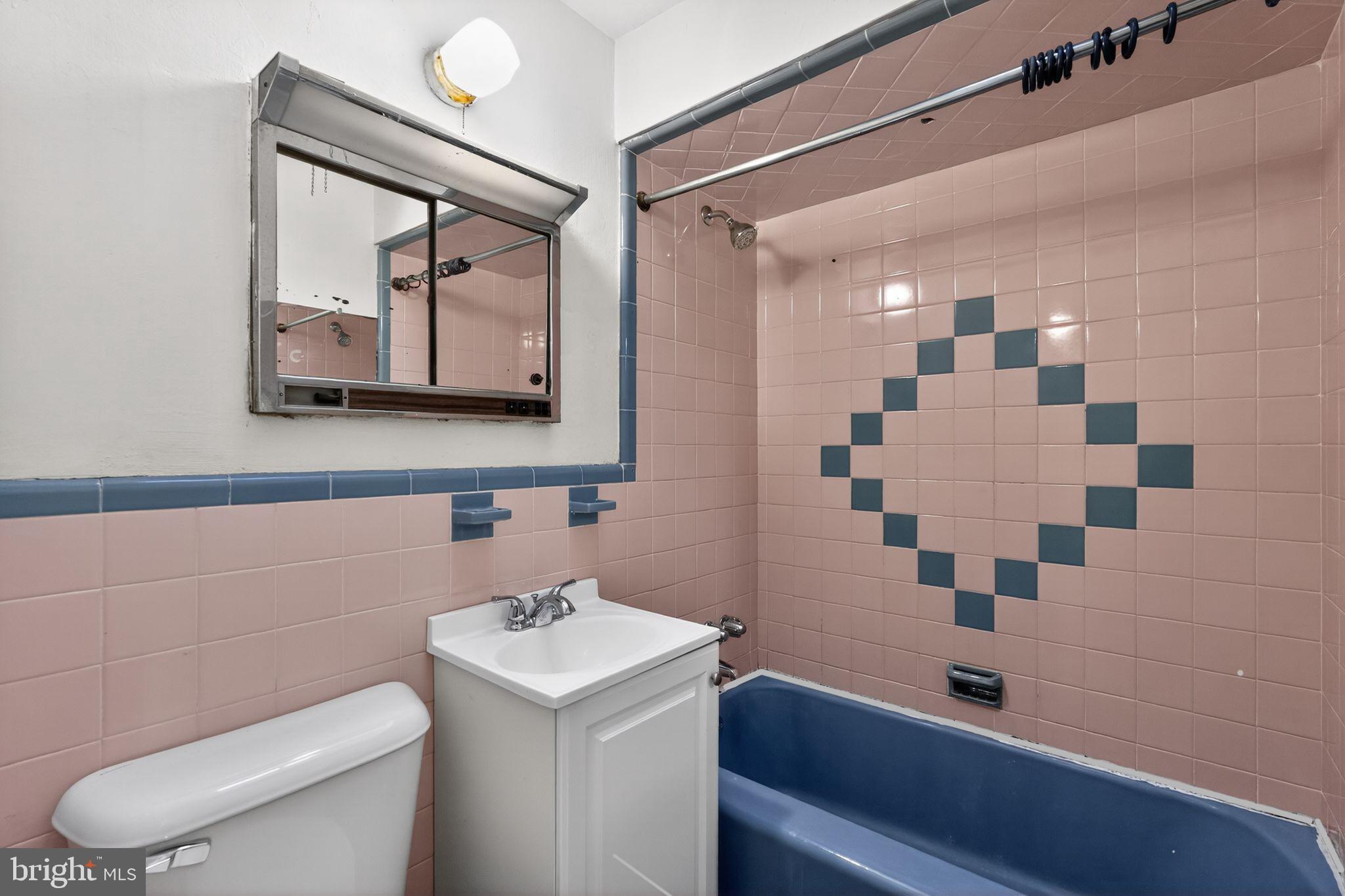 1017 Tyson Avenue Philadelphia, PA 19111 - Photo 19 of 23 a bathroom with a sink a toilet and shower
