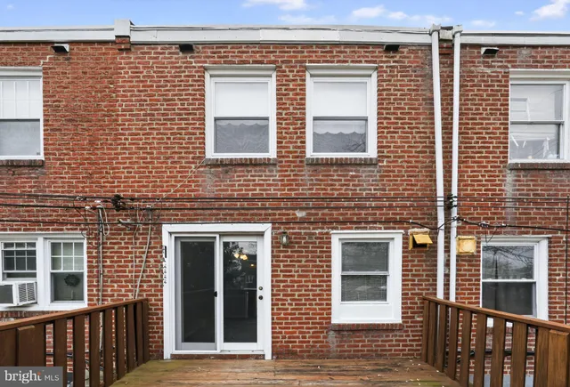 a view of a brick house with a large windows