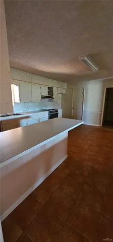 a view of a kitchen with a sink