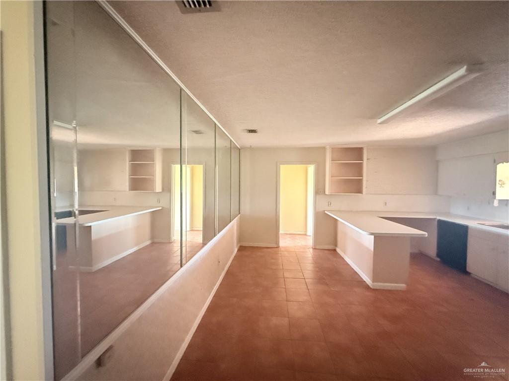 5300 East Richardson Road Edinburg, TX 78542 - Photo 10 of 12 a large white kitchen with a large window