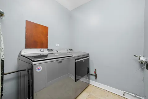 a utility room with washer and dryer
