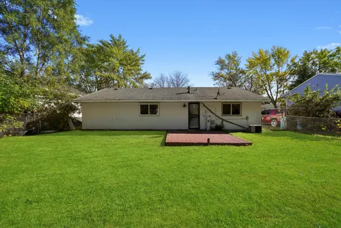 a view of a house with a backyard porch and sitting area