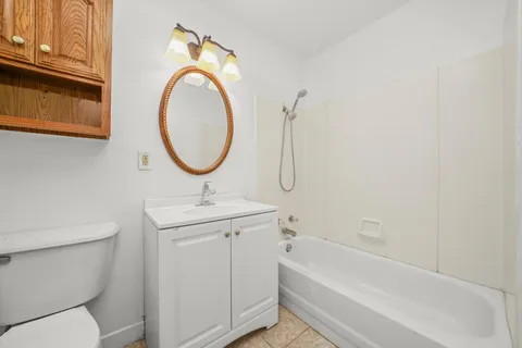 a bathroom with a sink a toilet and a bathtub